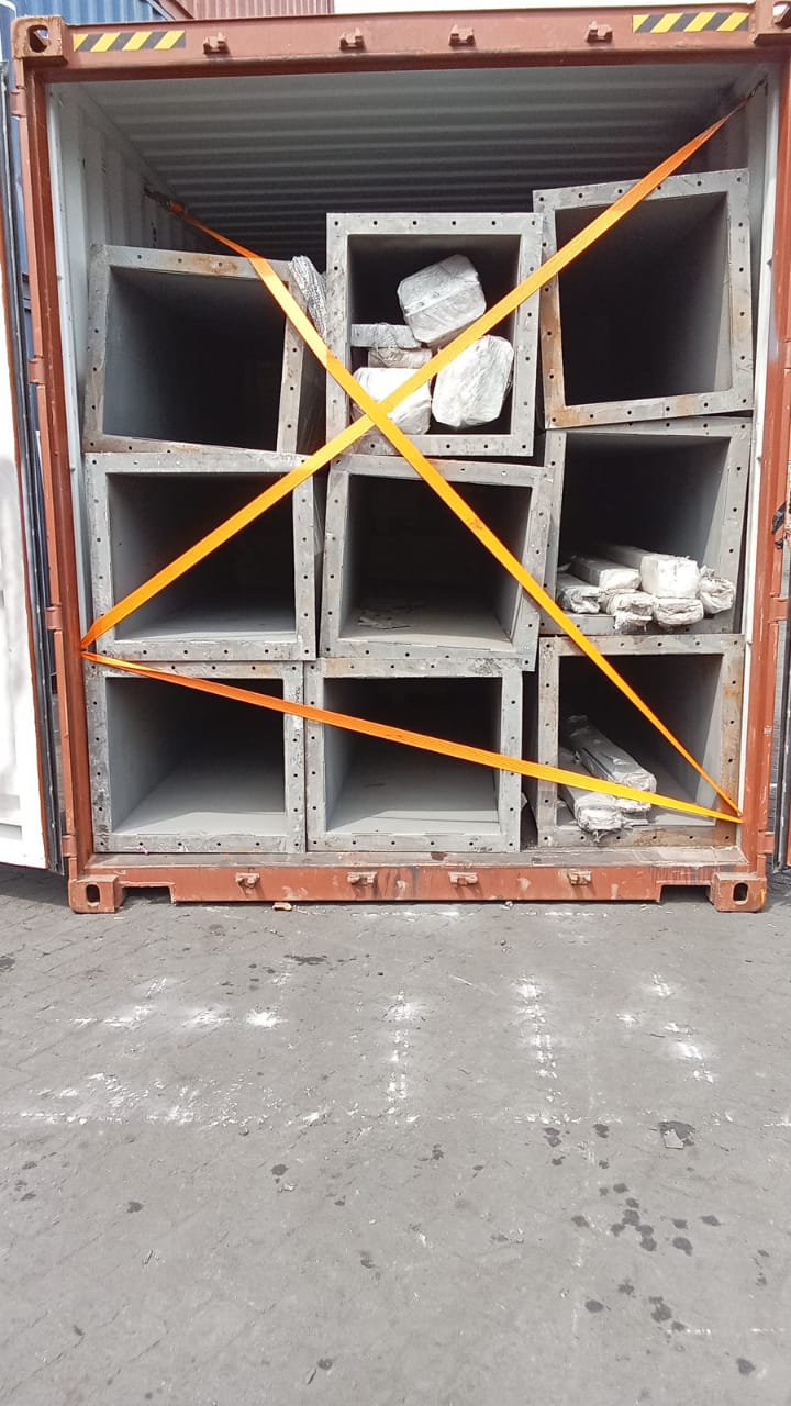 Steel box sections cross-strapped at a container door