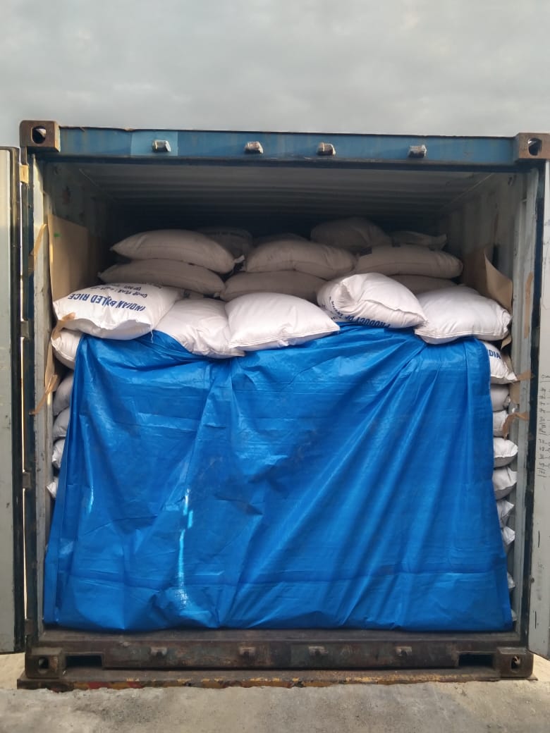 Bags of Indian boiled rice stuffed into a container